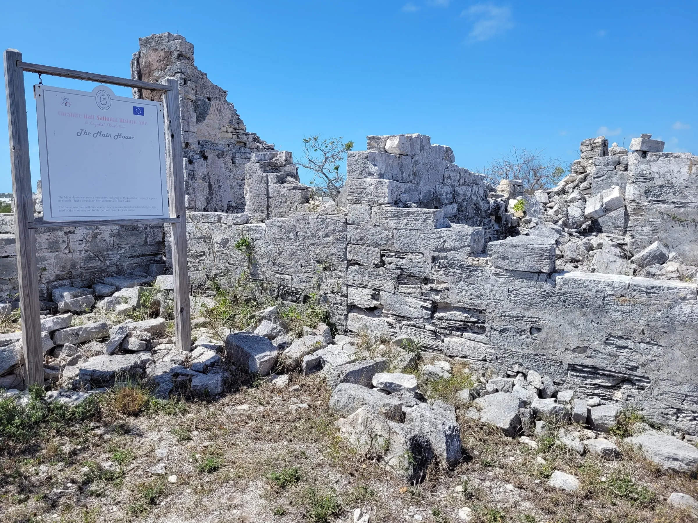 Limestone ruins of the main house at Cheshire Hall Plantation, with the National Trust sign